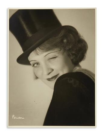 DIETRICH, MARLENE. Archive containing over 50 photographs, unsigned, some with holograph inscriptions,